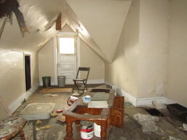 a wooden bench sitting in middle of a yard