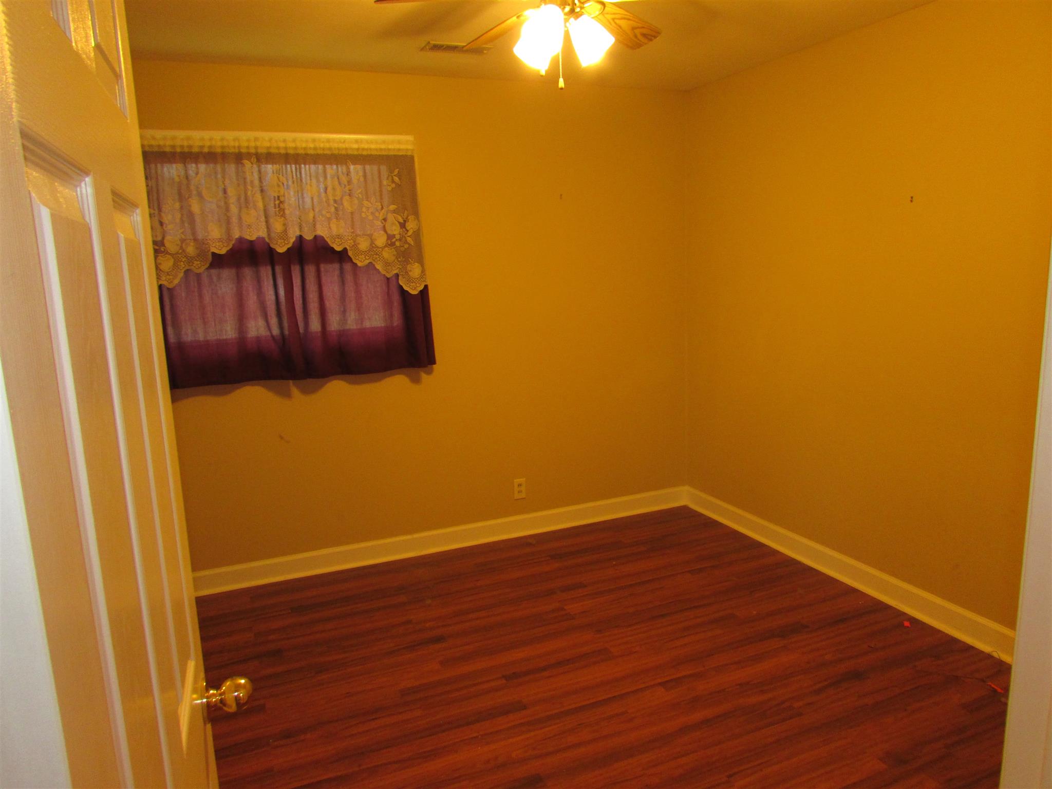 1704 3rd Avenue Manchester, TN 37355 - Photo 12 of 19 a view of a small space with wooden floor and a window