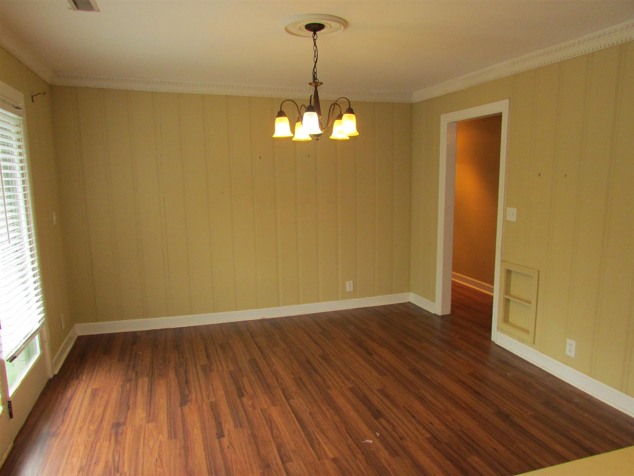 1704 3rd Avenue Manchester, TN 37355 - Photo 5 of 19 wooden floor in an empty room with a window