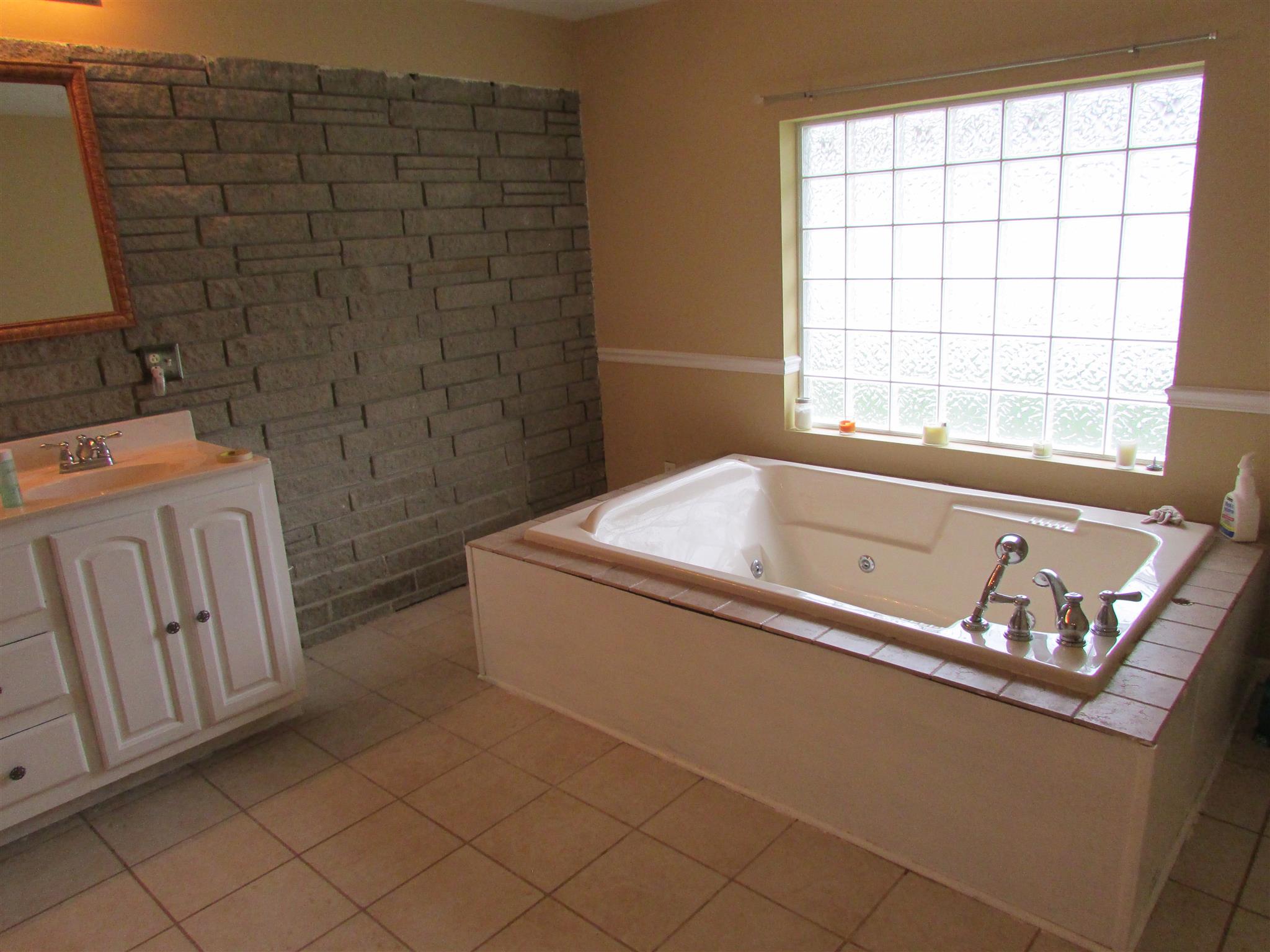 1704 3rd Avenue Manchester, TN 37355 - Photo 10 of 19 a bath tub sitting next to a window