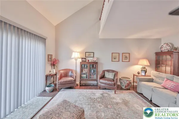 a view of a livingroom with furniture and a table