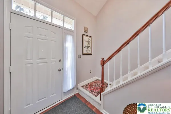a view of an entryway with wooden floor