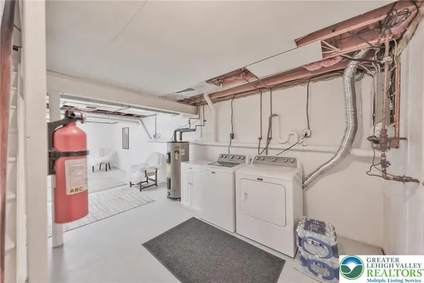 a bedroom with a bed and a lamp