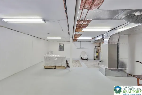 a bathroom with a toilet a sink and a mirror