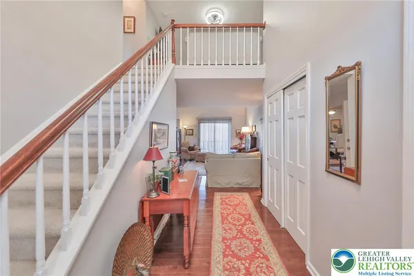 a living room with furniture and a lamp