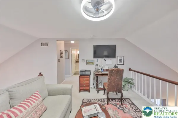 a bedroom with a bed and a table