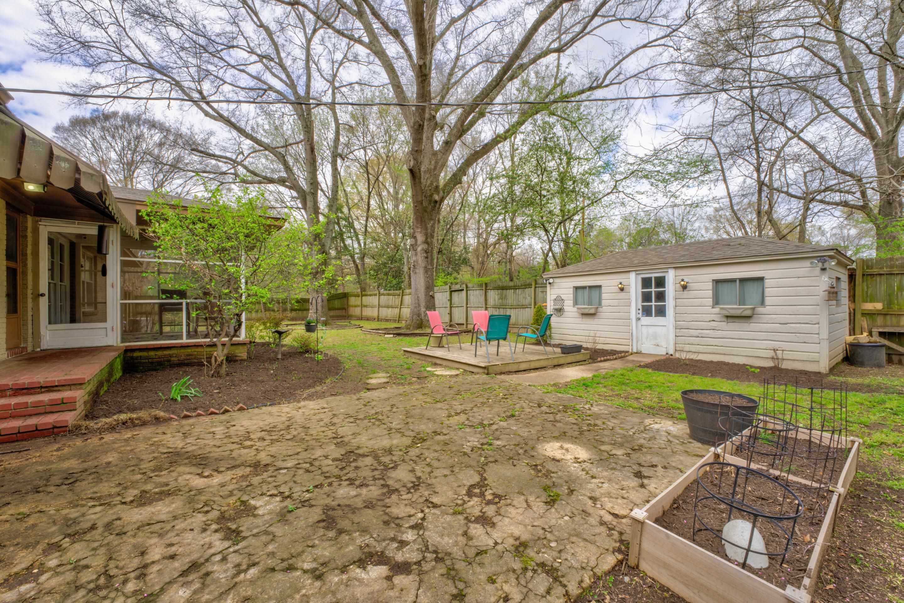 4682 Kaye Road Memphis, TN 38117 - Photo 14 of 17 a view of a yard with a house and a tree