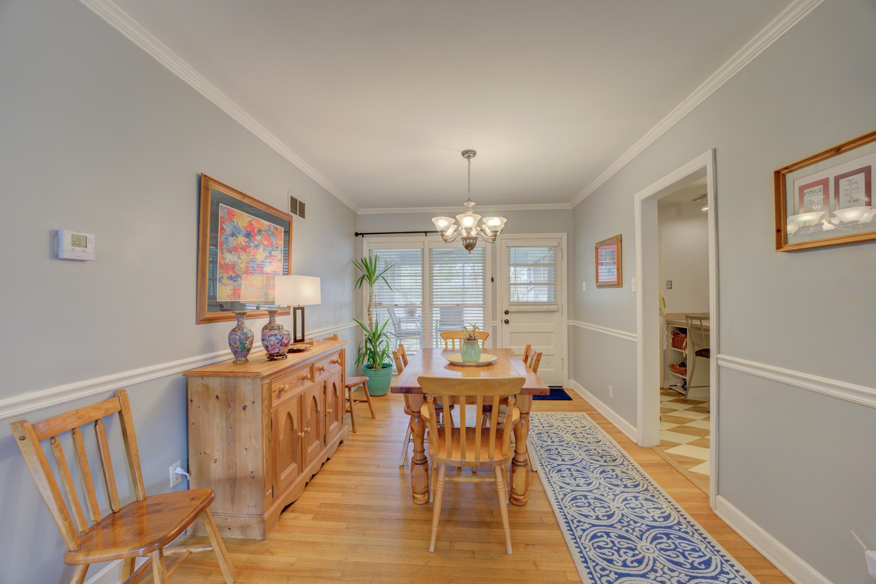 4682 Kaye Road Memphis, TN 38117 - Photo 4 of 17 a dining room with furniture a rug a flat screen tv and a rug