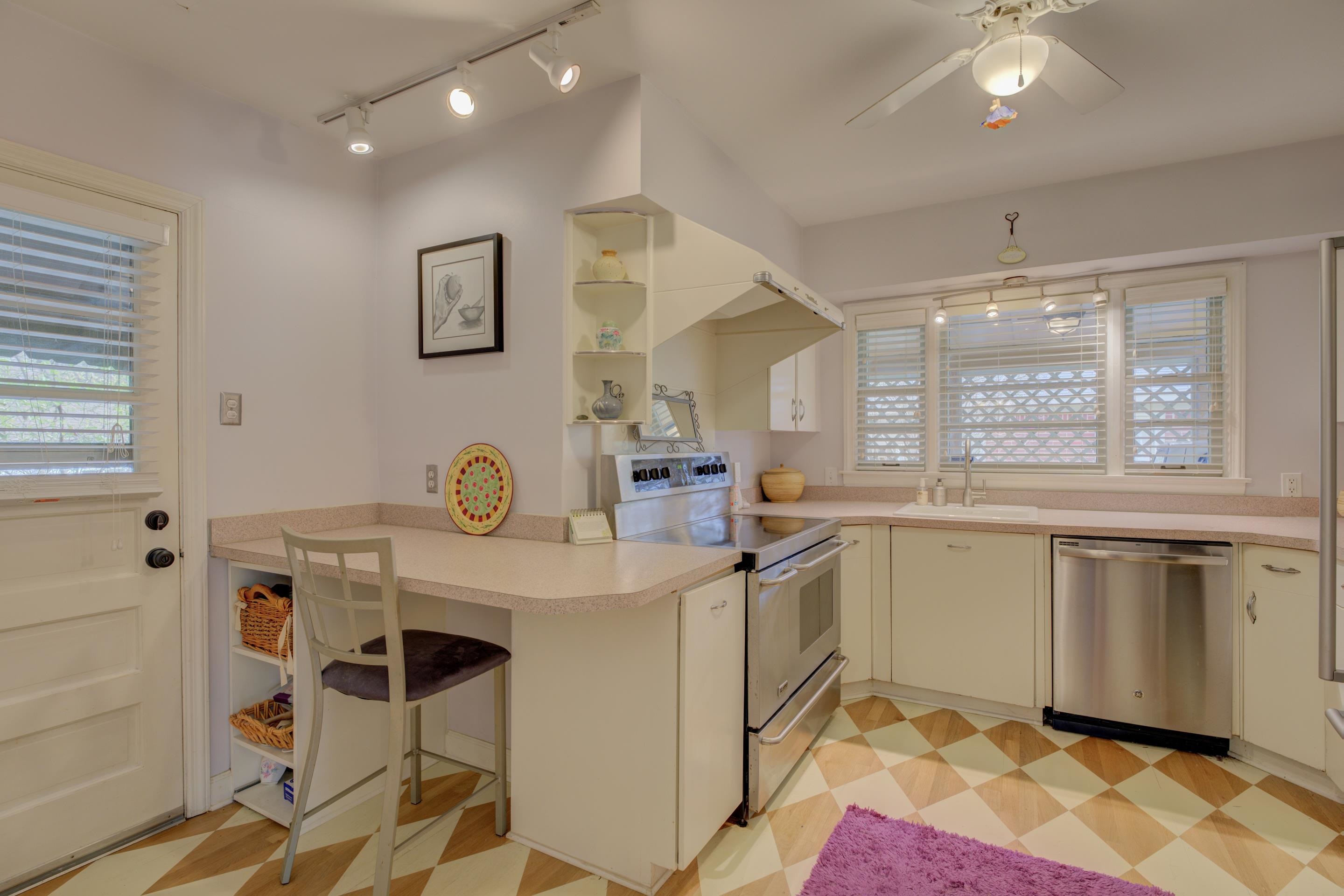 4682 Kaye Road Memphis, TN 38117 - Photo 5 of 17 a kitchen with stainless steel appliances granite countertop a sink and cabinets
