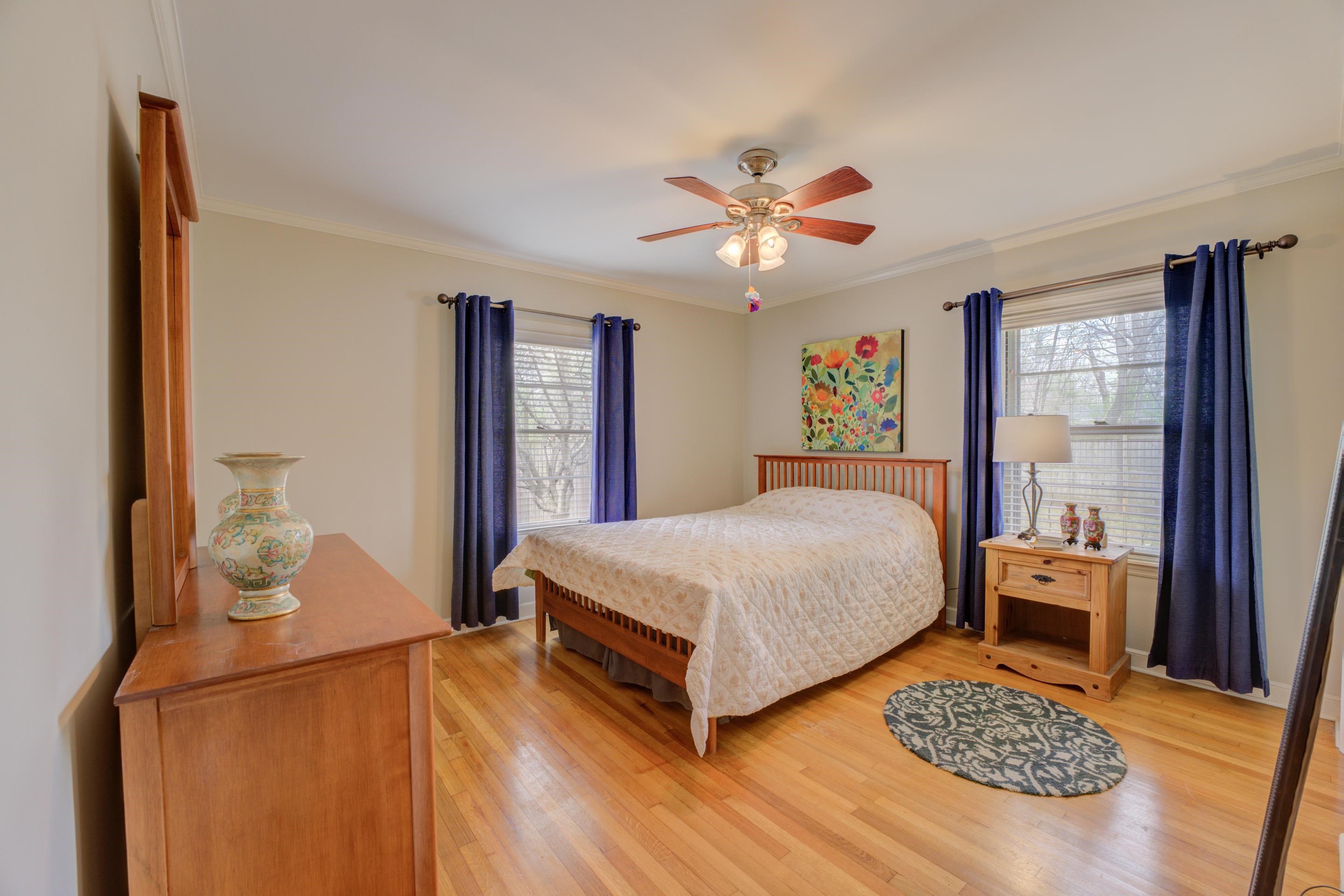 4682 Kaye Road Memphis, TN 38117 - Photo 10 of 17 a bedroom with a bed and dresser with wooden floor