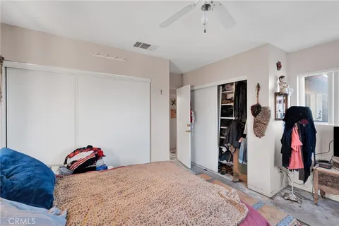 a bedroom with a bed and a walk in closet