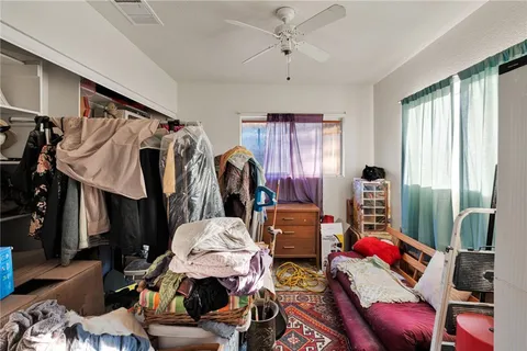 a bed room with furniture and a window