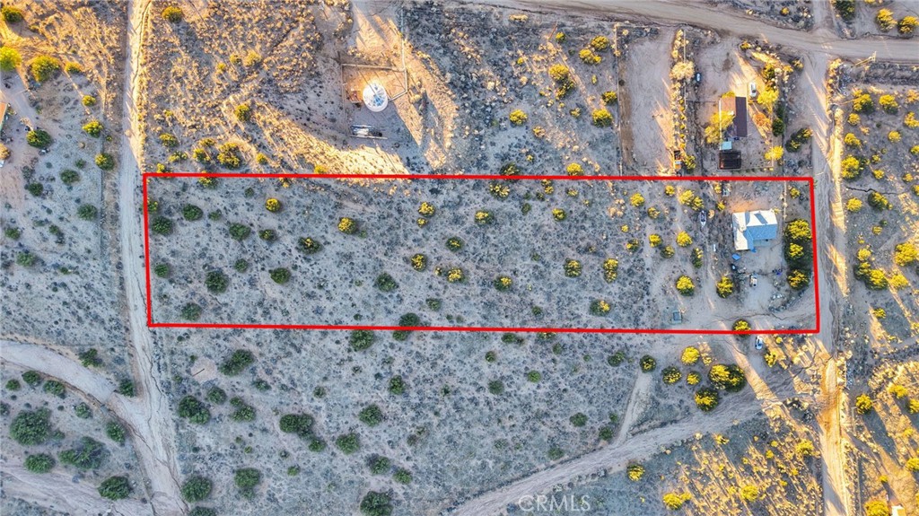 25735 Santa Rosa Road Apple Valley, CA 92308 - Photo 2 of 33 a street sign on the side of the wall