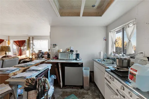 a view of a kitchen with appliances and cabinets
