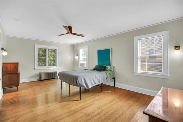a bathroom with a toilet sink and shower