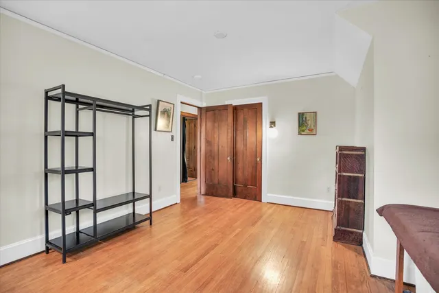 a view of room with closet and ceiling fan