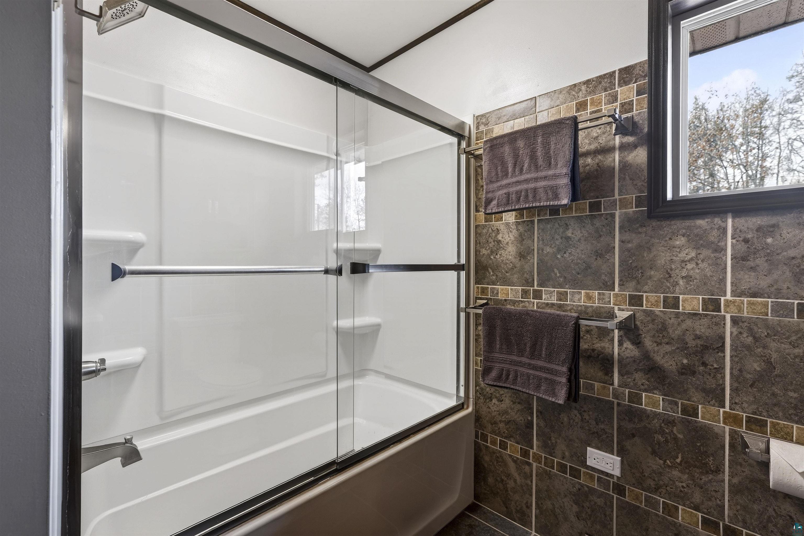 11702 East Mail Road Gordon, WI 54838 - Photo 43 of 49 Full bathroom featuring bath / shower combo with glass door