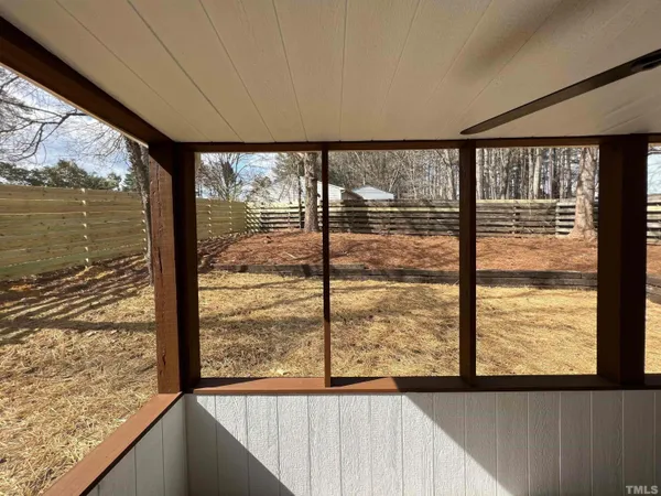 a view of a glass door with a roof deck