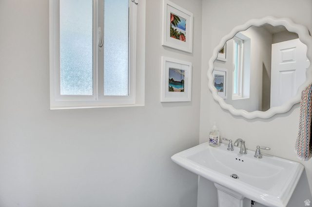 1350 Canyon Park Road Bountiful, UT 84010 - Photo 27 of 38 Pedestal sink with chrome-finish faucet and white scalloped mirror