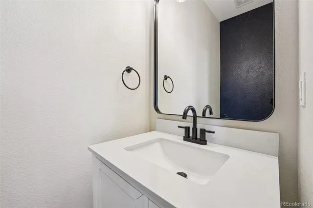 a view of an empty room with windows