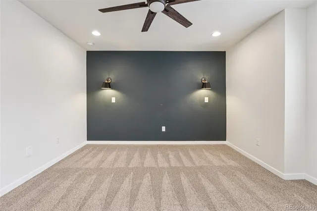 a bathroom with a granite countertop double vanity sink toilet and shower