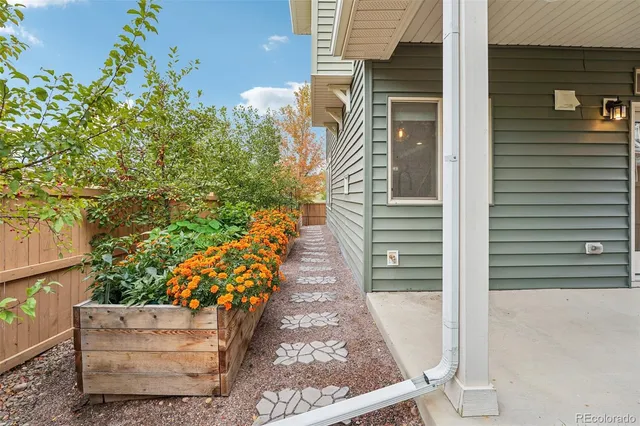 a view of a pathway both side of house