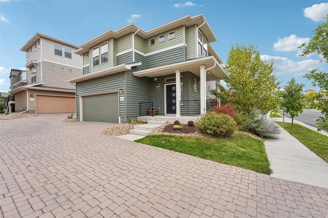 a house view with a wooden fence