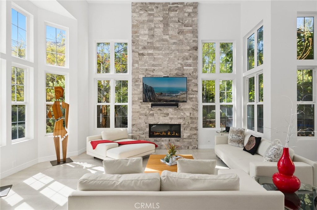 3 Bridgeport Road Newport Coast, CA 92657 - Photo 1 of 25 a living room with furniture and a fireplace