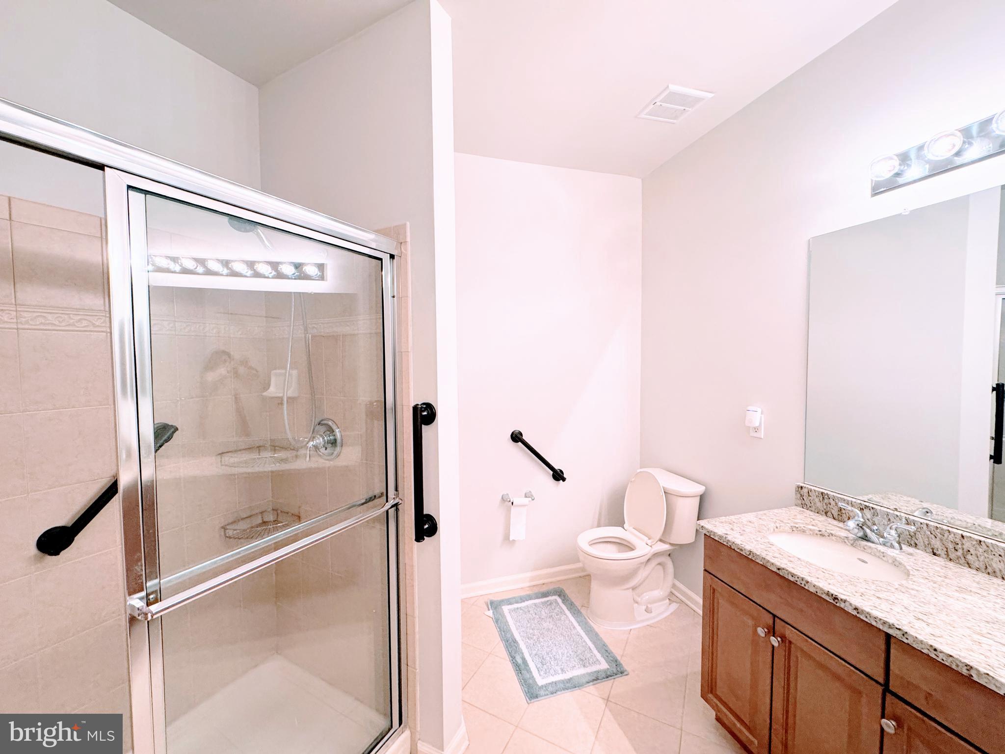 622 Masterson Court Ewing, NJ 08618 - Photo 14 of 26 a spacious bathroom with a granite countertop sink mirror and a shower