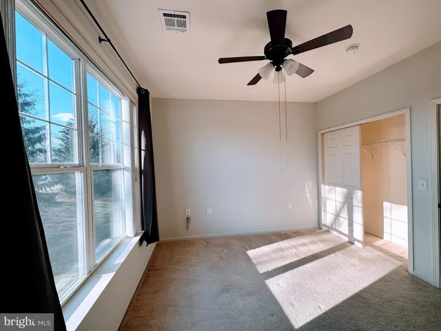 a view of an empty room and window