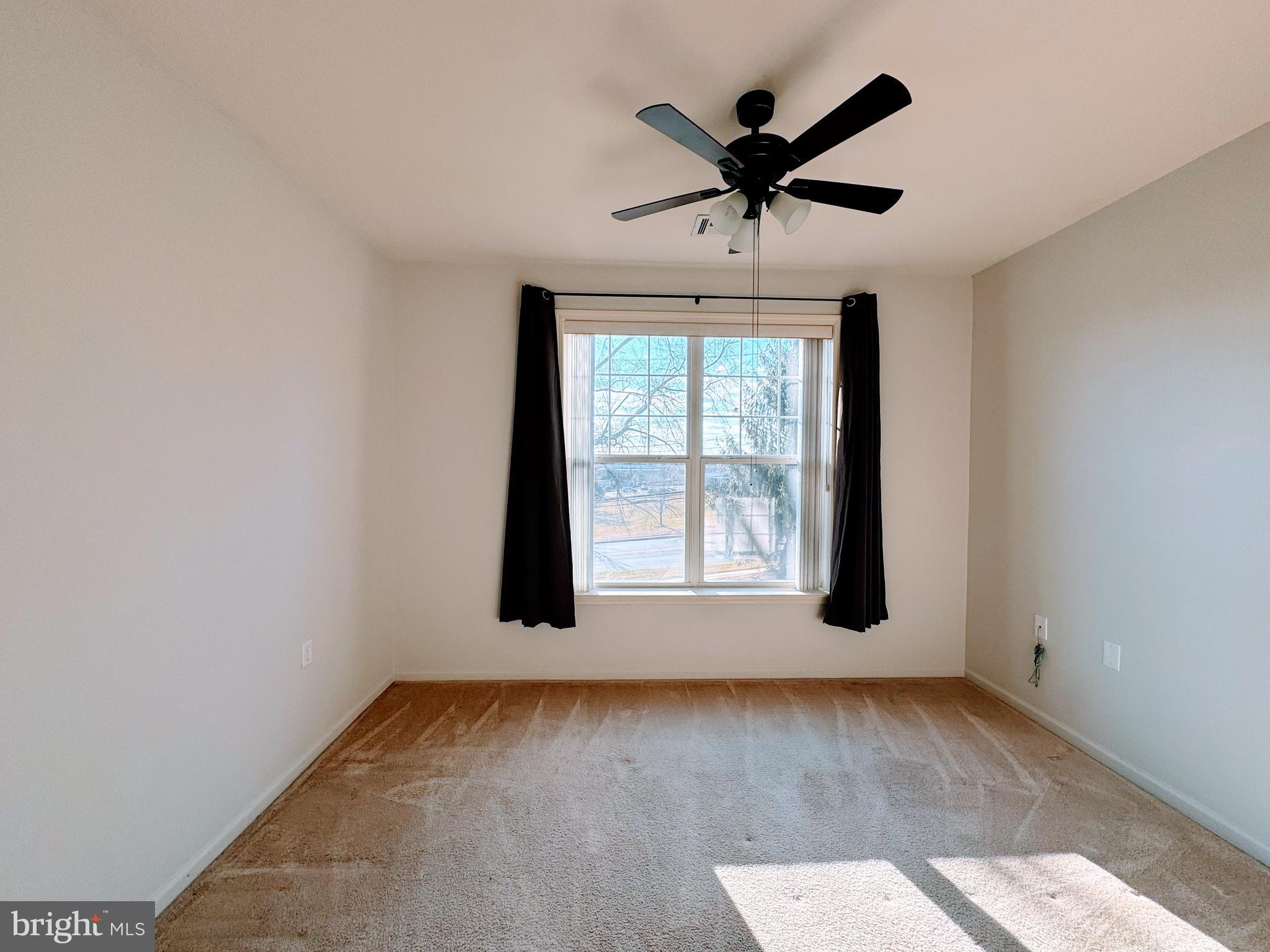 622 Masterson Court Ewing, NJ 08618 - Photo 16 of 26 an empty room with wooden floor and windows