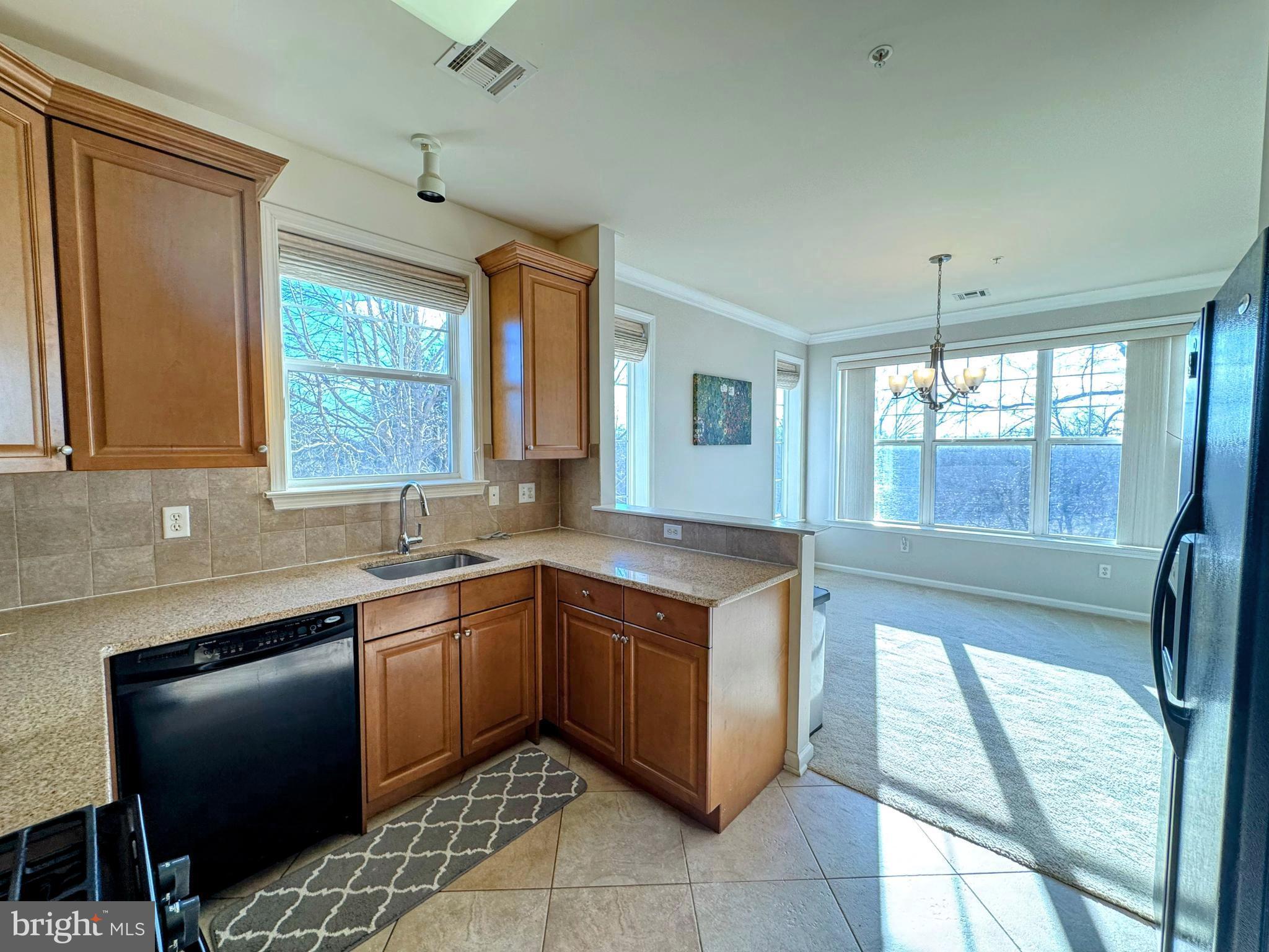 622 Masterson Court Ewing, NJ 08618 - Photo 2 of 26 a kitchen with a sink stove and cabinets