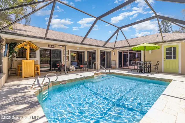 a view of a swimming pool with a patio