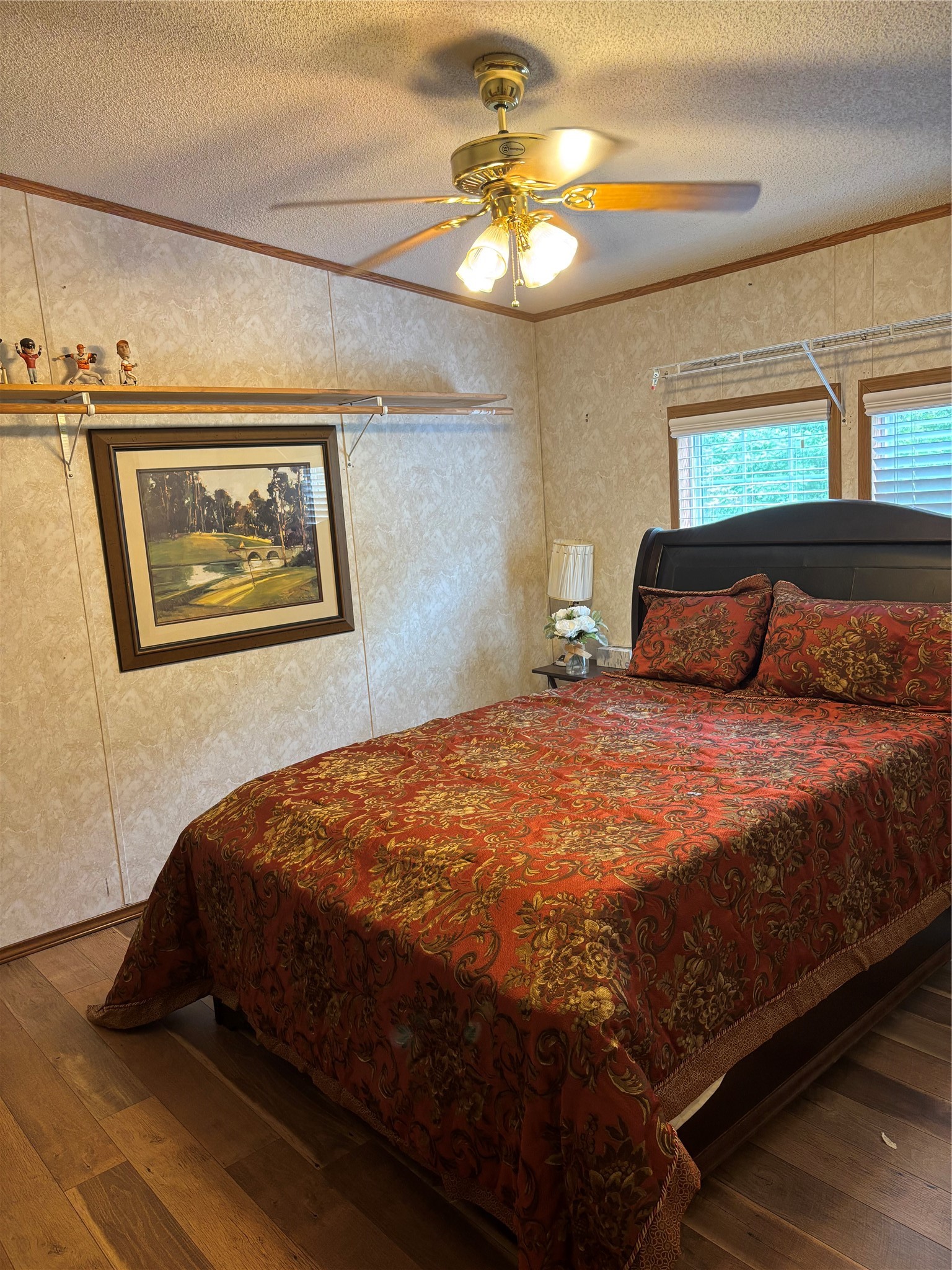 35599 State Highway South Buna, TX 77612 - Photo 33 of 40 a bedroom with a bed and a painting on the wall