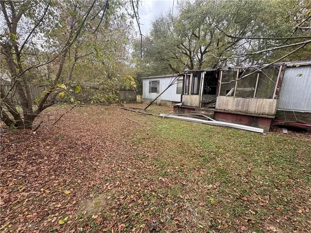 a view of a backyard with a small cabin