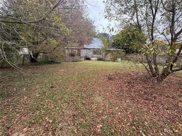a house view with a backyard space