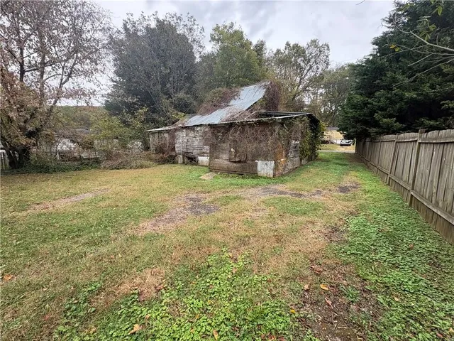 a view of a tiny house with a yard