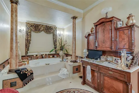 a bathroom with a granite countertop sink a toilet a mirror and shower
