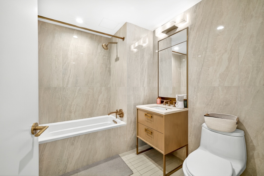 3 Court Square, Unit 621 Queens, NY 11101 - Photo 6 of 13 a bathroom with a sink toilet and shower