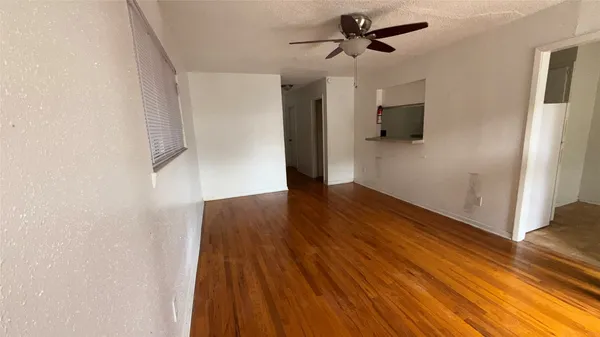 a view of a livingroom with wooden floor