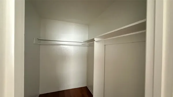a view of an empty walk in closet
