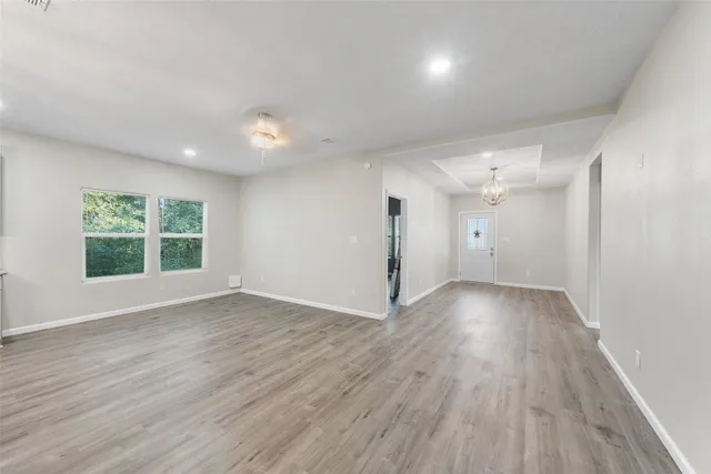 a view of an empty room with a window