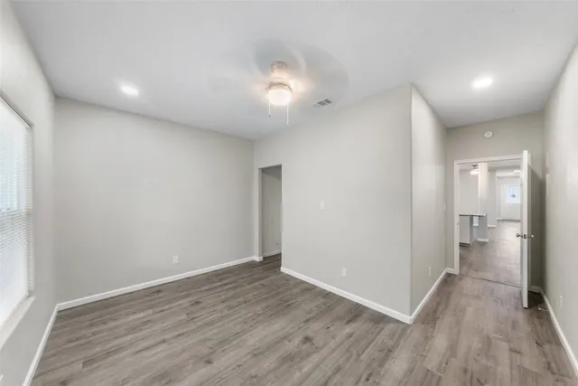 a bathroom with a sink a toilet and shower a mirror