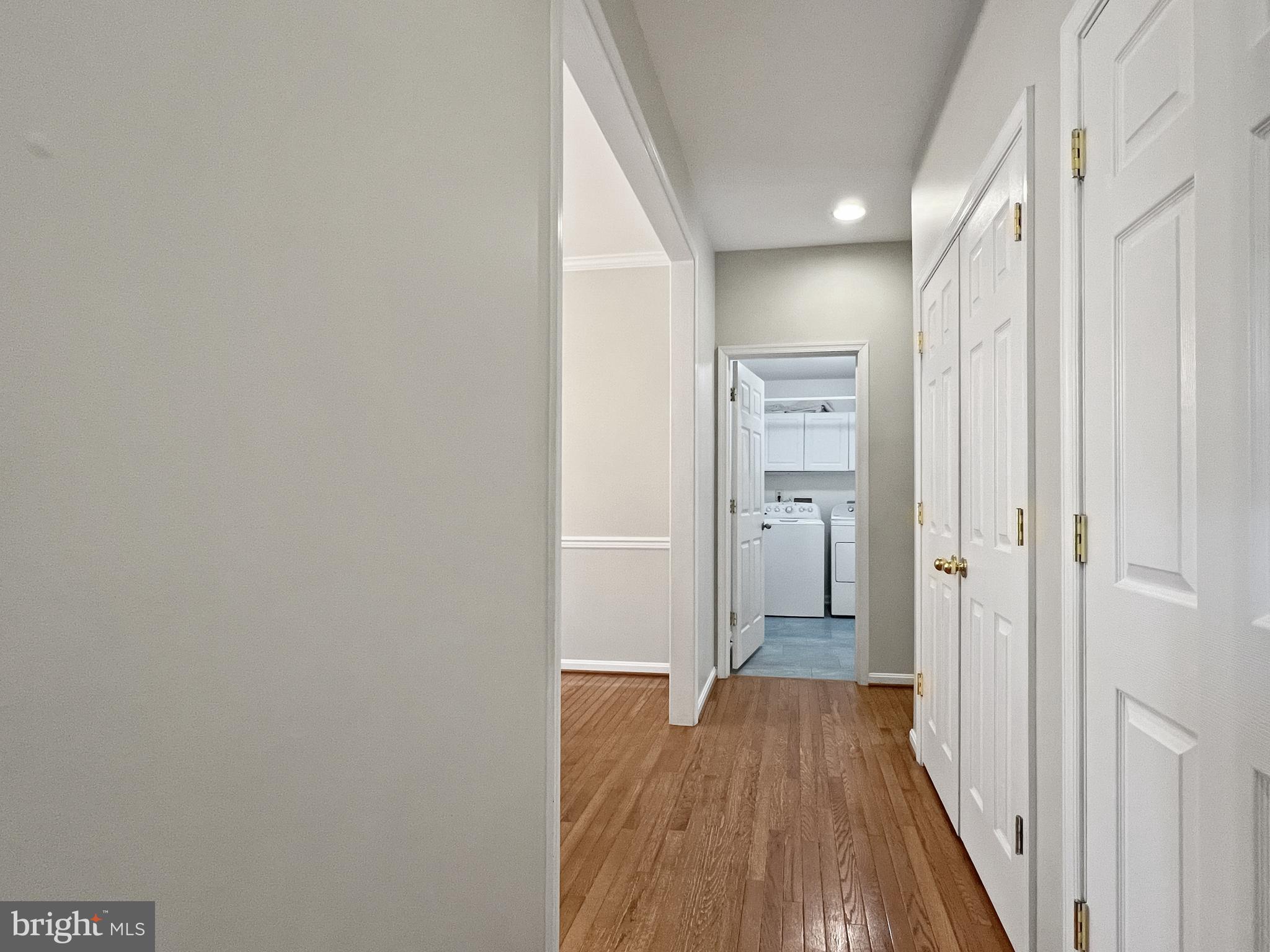 18210 Wickham Road Olney, MD 20832 - Photo 23 of 74 a view of a hallway with wooden floor and a bathroom