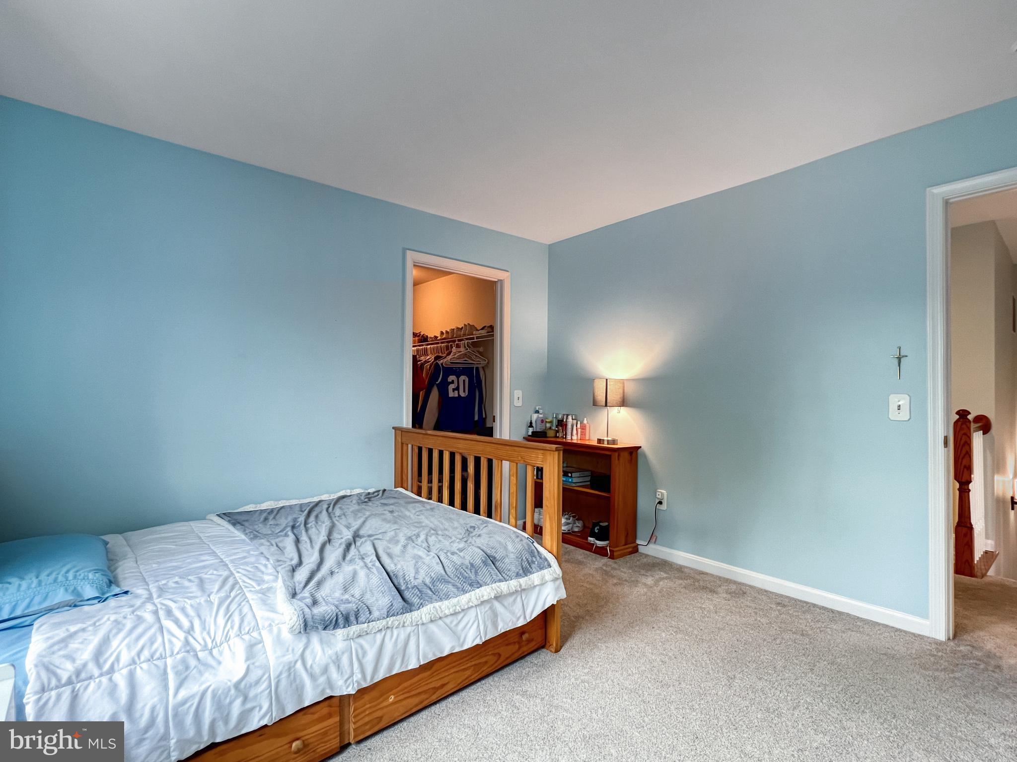 18210 Wickham Road Olney, MD 20832 - Photo 31 of 74 a bedroom with a bed and a tv