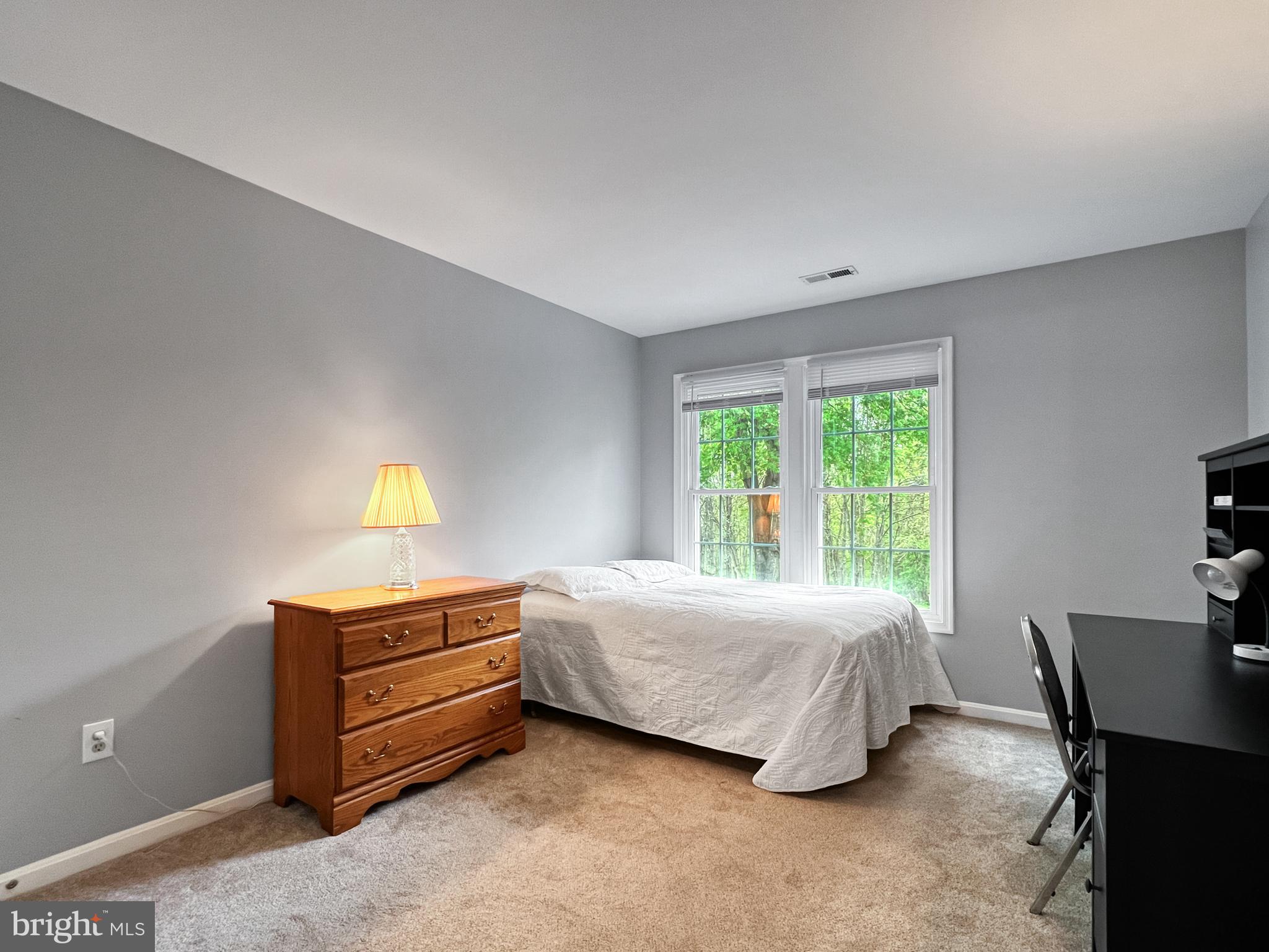 18210 Wickham Road Olney, MD 20832 - Photo 33 of 74 a bedroom with a bed and a window