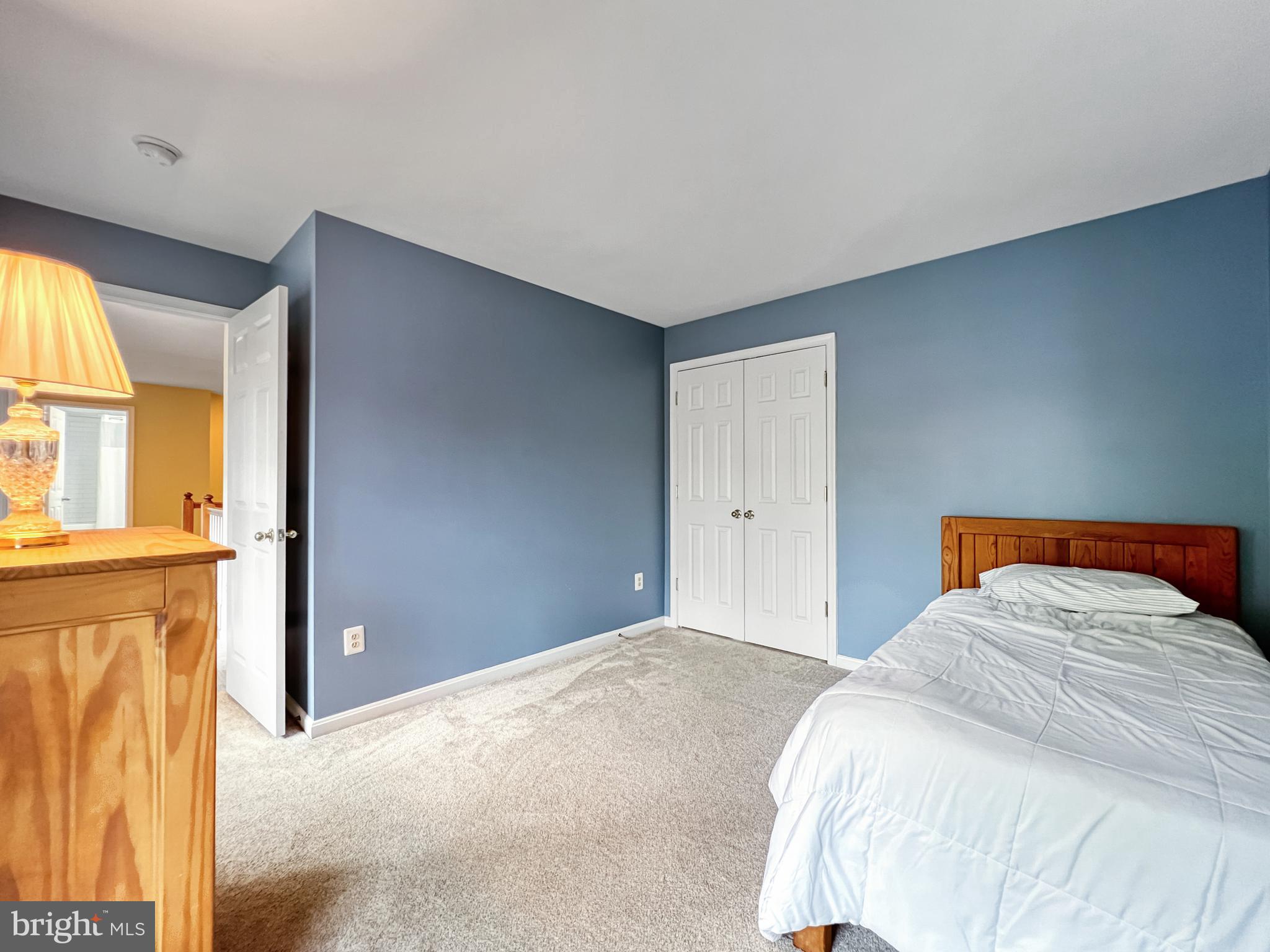 18210 Wickham Road Olney, MD 20832 - Photo 36 of 74 a bedroom with a bed and a window
