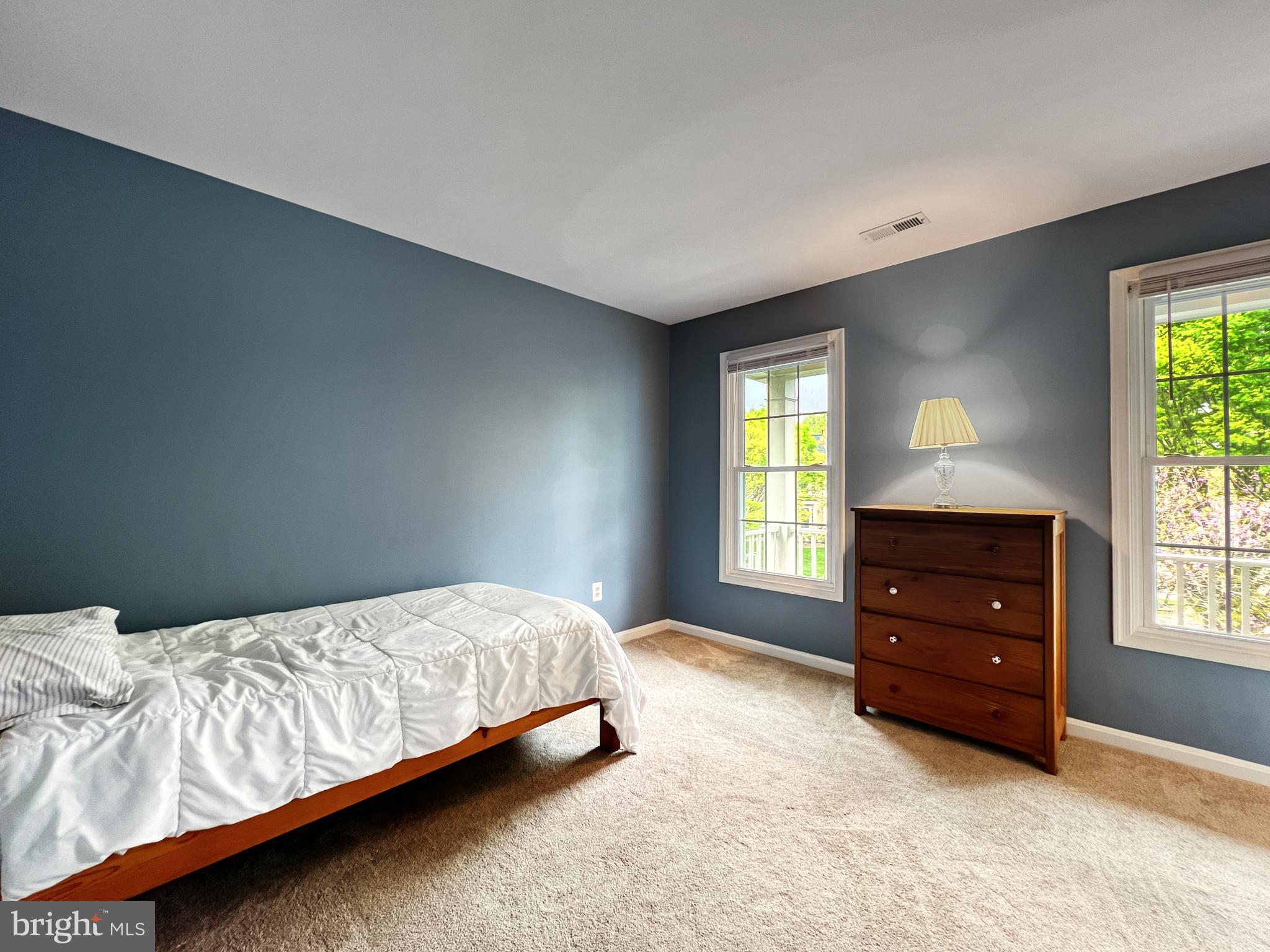 18210 Wickham Road Olney, MD 20832 - Photo 37 of 74 a bedroom with a bed and a window