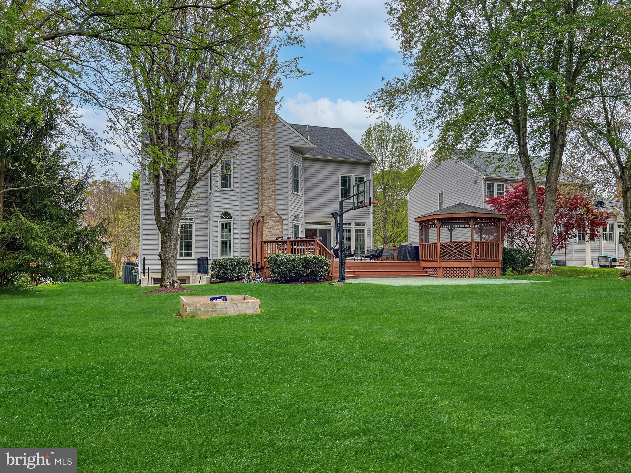 18210 Wickham Road Olney, MD 20832 - Photo 47 of 74 a front view of a house with garden and trees