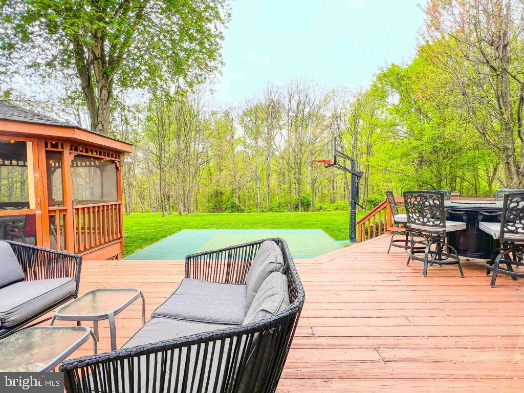 18210 Wickham Road Olney, MD 20832 - Photo 56 of 74 a view of a roof deck with chair and table